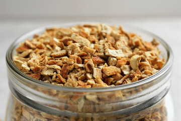 Jar of dried orange zest seasoning, closeup