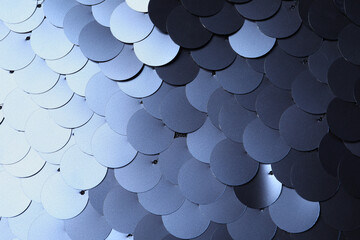 Texture of beautiful silver sequins as background, closeup