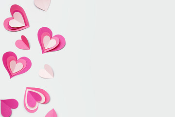 Composition with paper hearts on light background. Valentines Day celebration