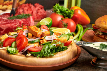 grilled chicken with vegetables and caesar salad 