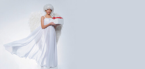 Valentines day banner with sexy angel woman. Girl with angel wings and a white dress. Angel girl. Cupid woman.