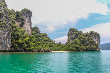 Small beach and green waters in Phang Nga Bay,