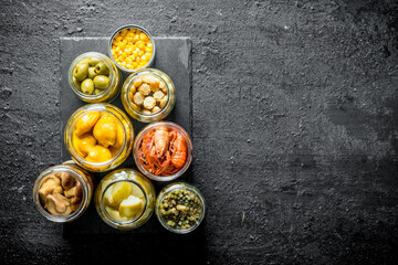 Homemade preserved food on a stone Board.