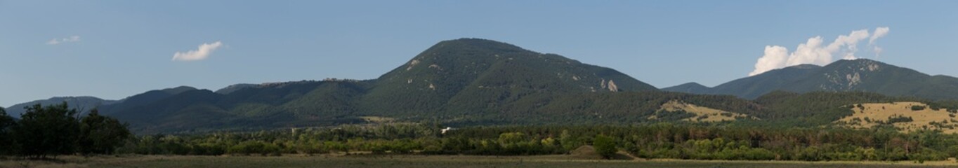 Fototapeta premium Panoramic terrain of southern Europe. Landscape of Bulgaria-mountains, fields, flora.
