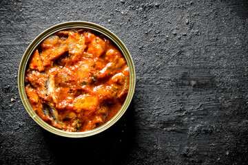 Sprat in tomato sauce in a tin can.