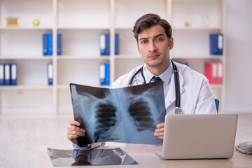 Young male doctor radiologist working in the clinic