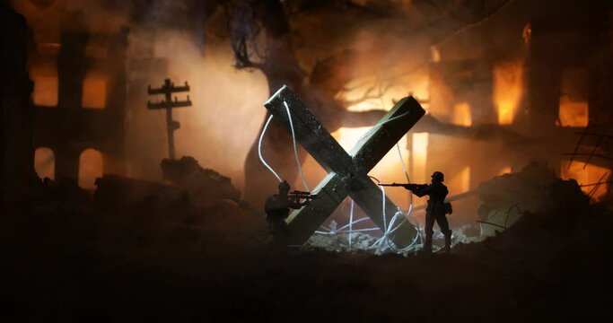 Concept of war or manipulation with global politics. The puppeteer controls soldiers. Night battle scene. Military fighting silhouettes in destroyed city. Selective focus