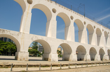 Landmark white arches of Arcos da Lapa under bright blue skies in Centro of Rio de Janeiro Brazil