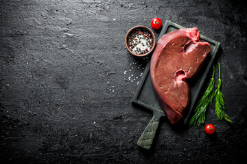 Raw liver with spices, herbs and tomatoes.