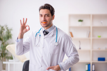 Young male doctor wearing mouthguard