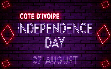 Happy Independence Day of Cote d'Ivoire, 07 August. World National Days Neon Text Effect on bricks background