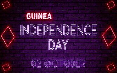 Happy Independence Day of Guinea , 02 October. World National Days Neon Text Effect on bricks background