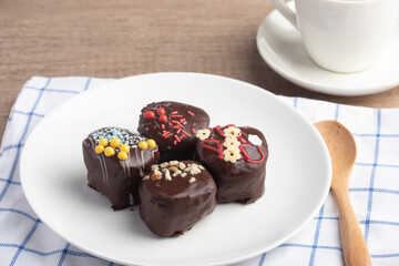 Chocolate ball snacks on a white plate