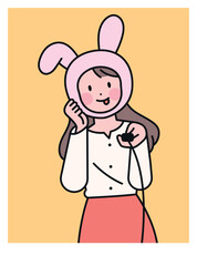 A woman taking a selfie with a camera switch in her hand. cute rabbit mask.