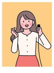 A woman taking a selfie with a camera switch in her hand. finger heart.