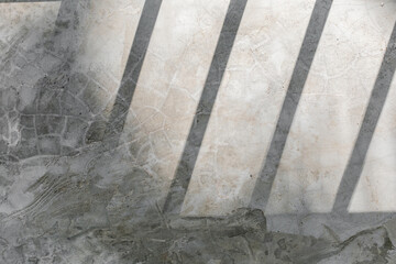Polished grunge concrete texture with sunny shadows background