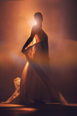 Orange lighting, fantasy and silhouette of woman with stylish dress for creative fashion, art deco...