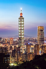 Obraz premium View from above, stunning aerial view of the Taipei City skyline illuminated at sunset. Panoramic view from the Mount Elephant in Taipei, Taiwan.