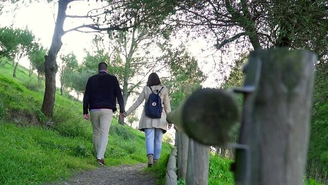 Couple Holding Hands Walking Together In Beautiful Quiet Park In Nature, Medina, Spain