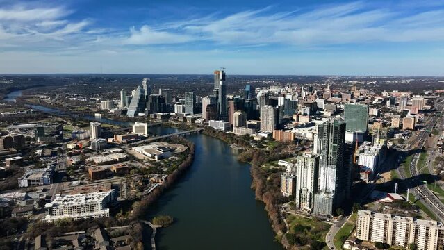 Downtown Austin and the Colorado river, fall in sunny US - aerial, slow, approach