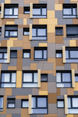 Vertical view of colorful geometric facade of modern architecture apartment building, Montpellier, France
