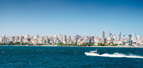 Fototapeta premium Panoramic view from the sea to Istanbul. The boat is sailing on the waves in the Sea of Marmara summer sunny day.