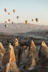 Goreme, Turkey - Mountain landscape with hot air balloons in Goreme, Cappadocia, Turkey