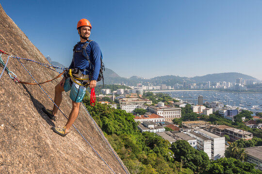 Rock climber on Babilonia Mountain, Rio de Janeiro, Brazil