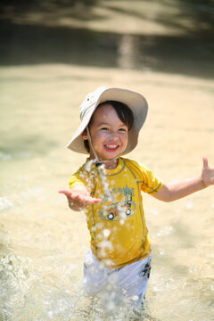 A little boy plays in Eli Creek, on Fraser Island, Australia