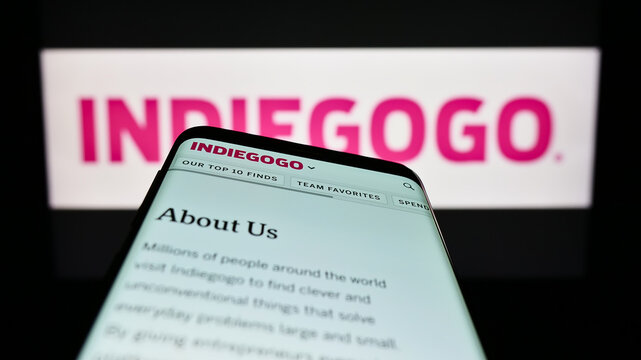 Stuttgart, Germany - 01-14-2023: Mobile phone with website of US crowdfunding company Indiegogo Inc. on screen in front of business logo. Focus on top-left of phone display.
