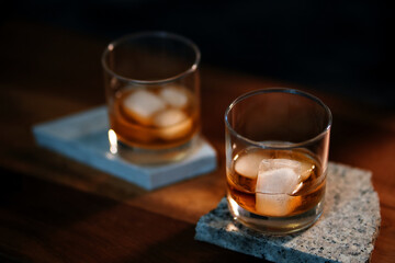 The glass of an iced bourbon whiskey