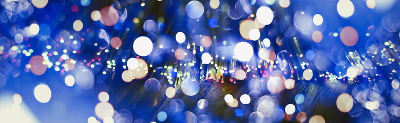 Holiday glowing backdrop. Defocused Background With Blinking Stars.