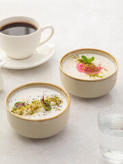 Side view on two different cereal porridge bowls