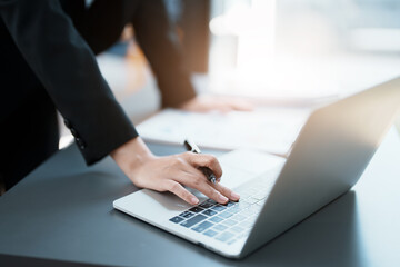 Portrait of a beautiful Asian teenage girl using a computer