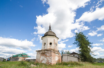 Fototapeta na wymiar The ancient helmet-shaped tower of the fence of the Oshevensky Monastery. Russia, Arkhangelsk region, Kargopolsky district