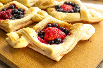Puff pastry with strawberries and blueberries. food concept