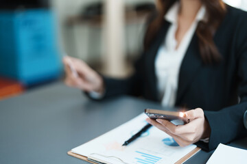 Online Shopping and Internet Payments, Asian woman are using their credit card and mobile phone to shop online or conduct errands in the digital world.