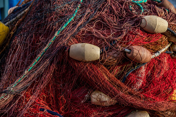 Colorful fishing nets on Marina Corricella on Procida Island, Bay of Naples, Italy.