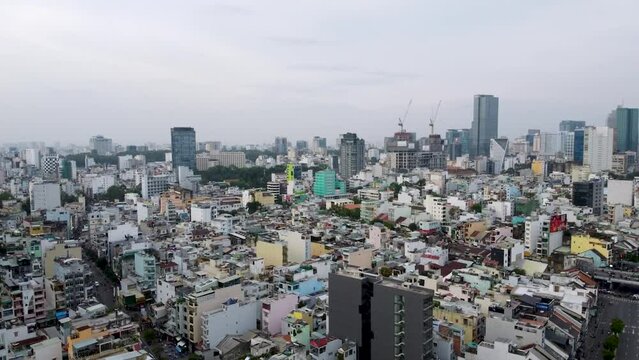 Aerial view of Ho Chi Minh City, Skyscrappers in the background, Morning haze, pullback shot