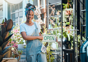 Obraz na płótnie Canvas Flowers, open sign and florist portrait of woman, startup small business owner or store manager with retail sales choice. Commerce shopping service, plant market or African worker with garden product