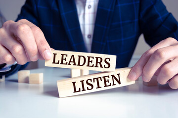 Close up on businessman holding a wooden block with 