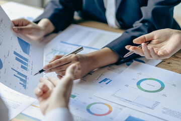 Intelligence analysis concept, group of business people brainstorm discussing current finance and economy on company investment laptop at meeting