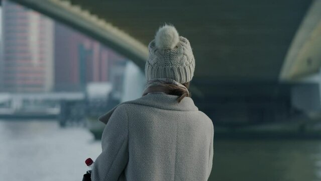 Hand-held shot of a woman making memories on her smartphone from a boat trip in Rotterdam
