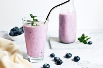 Homemade blueberry smoothie with fresh blueberries. Diets and detox. Healthy refreshing drink,...