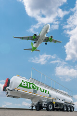 Airplane and biofuel tank trailer. New energy sources concept	