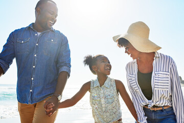 Black family, happy and walking on a beach with child or kid on vacation or holiday at the ocean or sea. Travel, sunshine and African parents relaxing with daughter holding hands together on a trip
