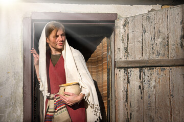 Girl with a pot in ancient clothes