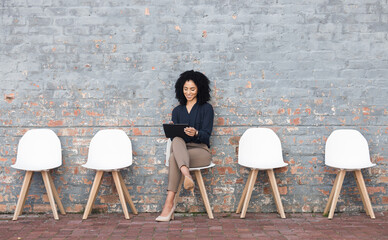 Job search, tablet and black woman in waiting room on brick wall for career opportunity, hr website...