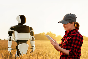 Woman farmer controls robot on an agricultural wheat field. Smart farming concept