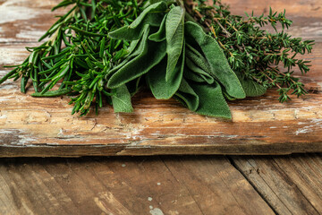 rosemary, thyme and sage, Herbal Tea on a wooden background, banner, menu, recipe place for text, top view